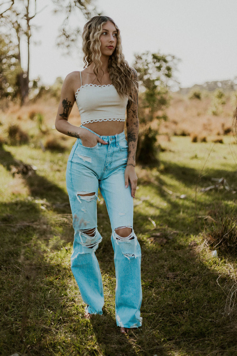 Wild Cactus Boutique Dirty Queen lace tie crop top with intricate lace details and adjustable tie front.