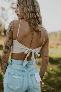 Wild Cactus Boutique Dirty Queen Lace Tie Crop Top with intricate lace detailing and a stylish tie front design.
