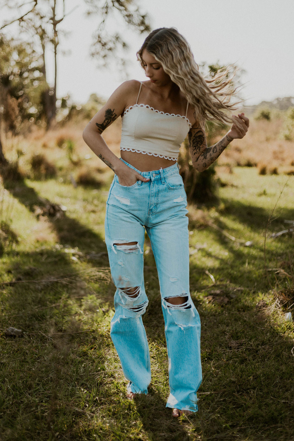 Wild Cactus Boutique Dirty Queen lace tie crop top with intricate lace details and a stylish tie front design.