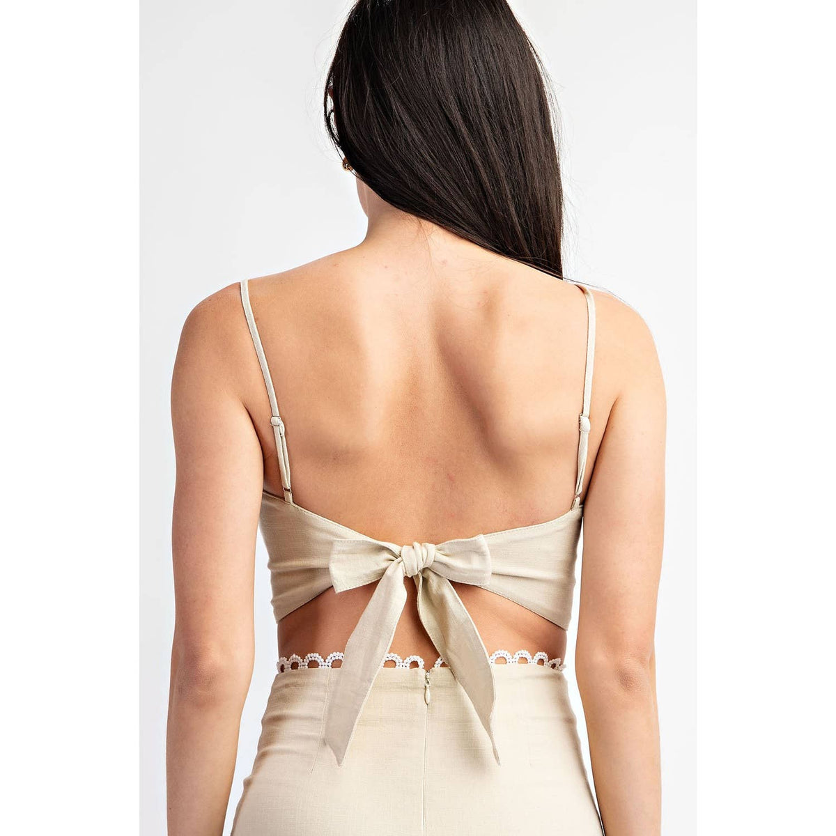 Wild Cactus Boutique Dirty Queen lace tie crop top with intricate lace details and a trendy tie-front design.