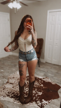 Beige Wild Honey Lace Corset crop top from Wild Cactus Boutique, featuring intricate lace details and a fitted design.