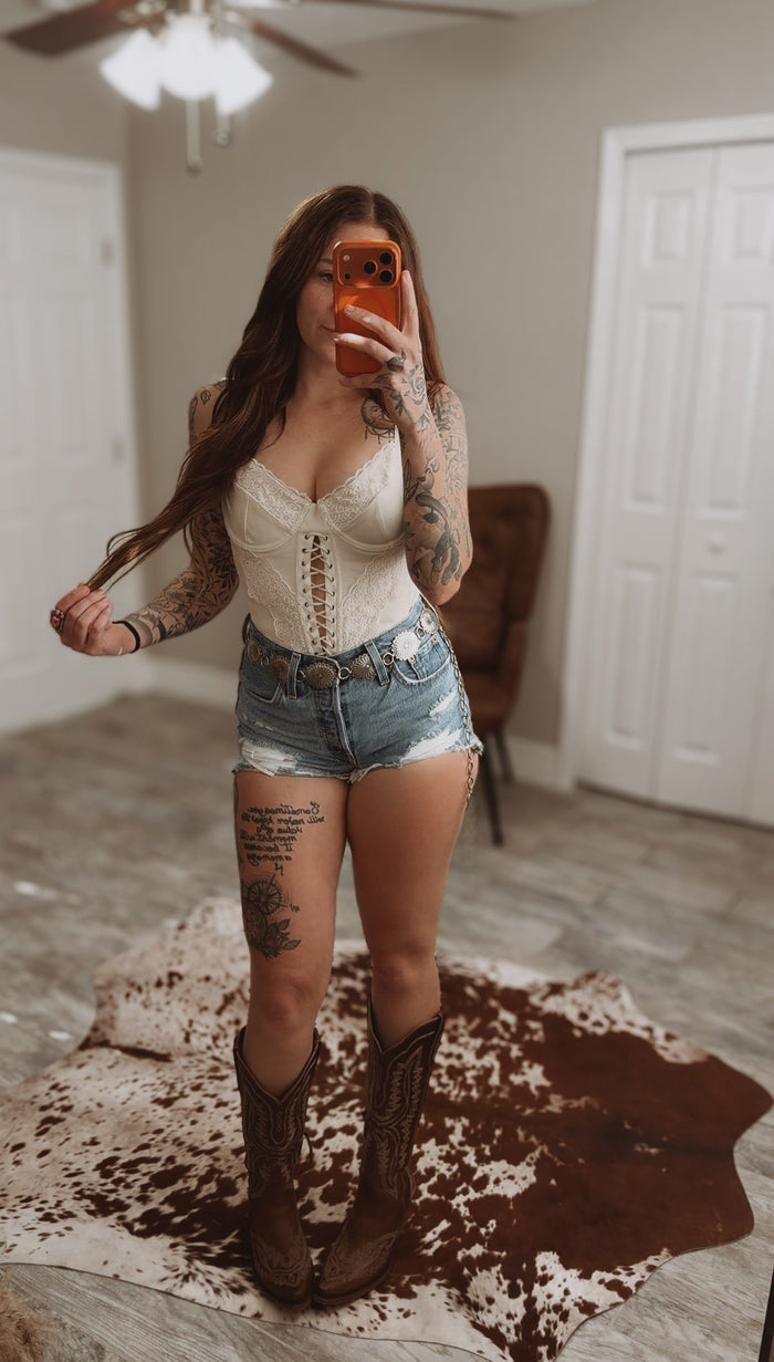 Beige Wild Honey Lace Corset crop top from Wild Cactus Boutique, featuring intricate lace details and a fitted design.