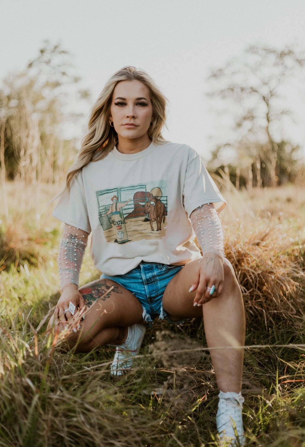 Wild Cactus Boutique rodeo scene western graphic top featuring a colorful cowboy and horse design on soft fabric.