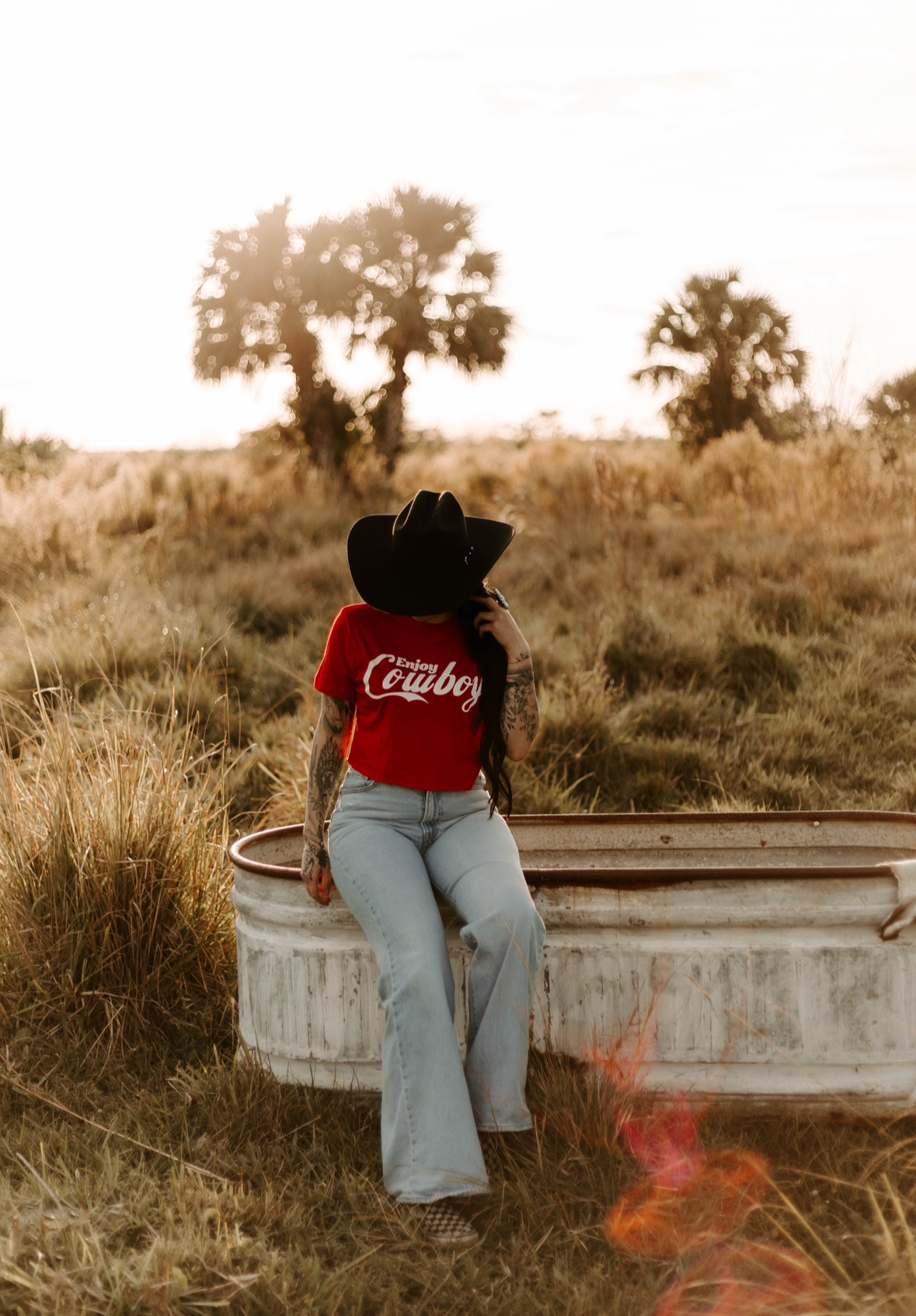 Women's cowboy crop top by Wild Cactus Boutique featuring a graphic design, perfect for casual and trendy Western-inspired outfits.