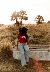 Women's cowboy crop top by Wild Cactus Boutique featuring a graphic design, perfect for casual and trendy Western-inspired outfits.