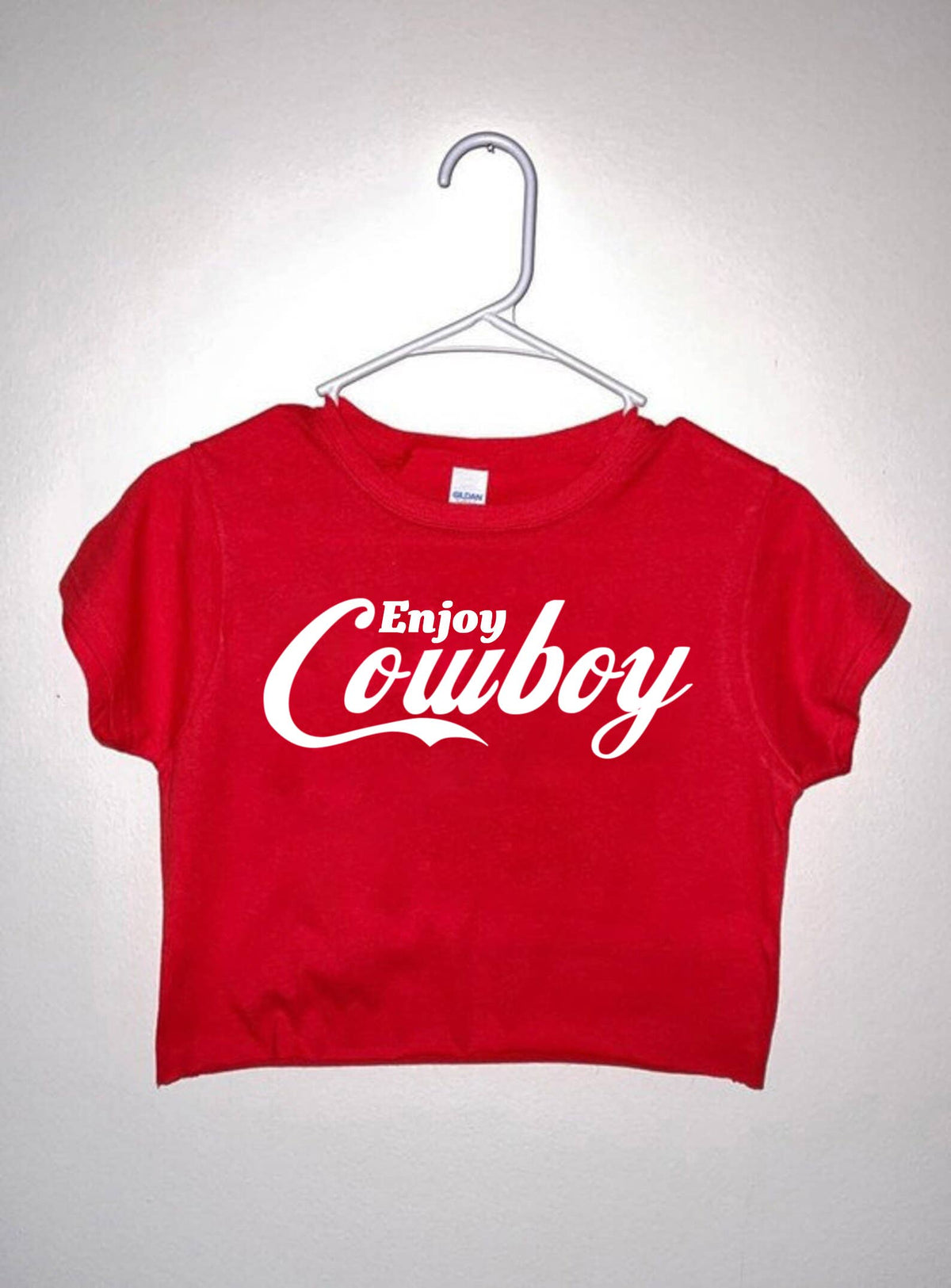 Women's graphic cowboy crop top by Wild Cactus Boutique featuring a stylish western-inspired design.