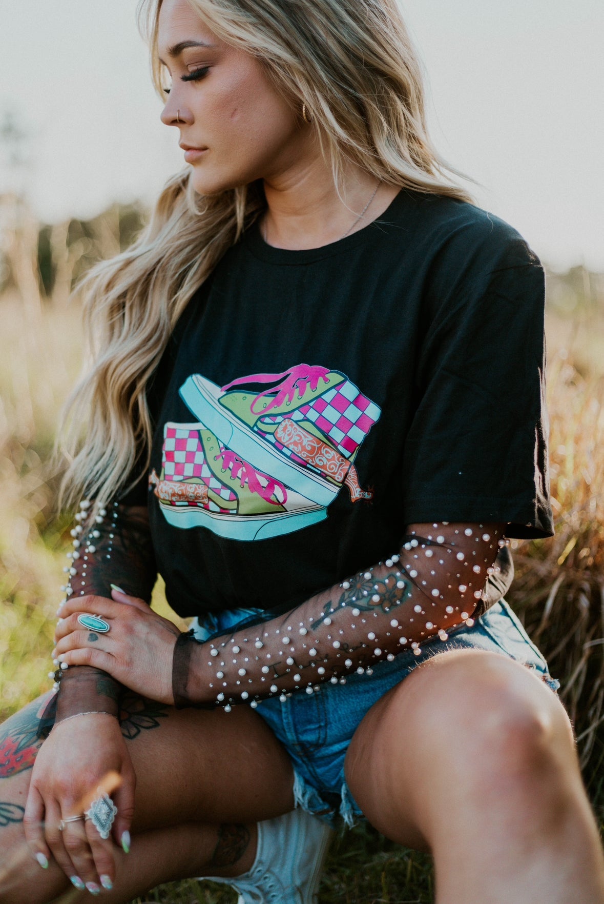 Neon Off The Wall Western graphic tee pullover by Wild Cactus Boutique, featuring vibrant western-themed artwork on a casual shirt.