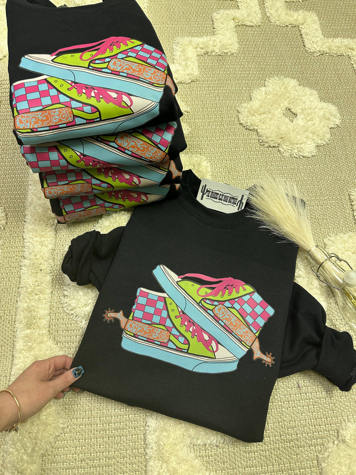Neon Off The Wall Western graphic tee pullover by Wild Cactus Boutique featuring a vibrant Western-themed design on a casual shirt.