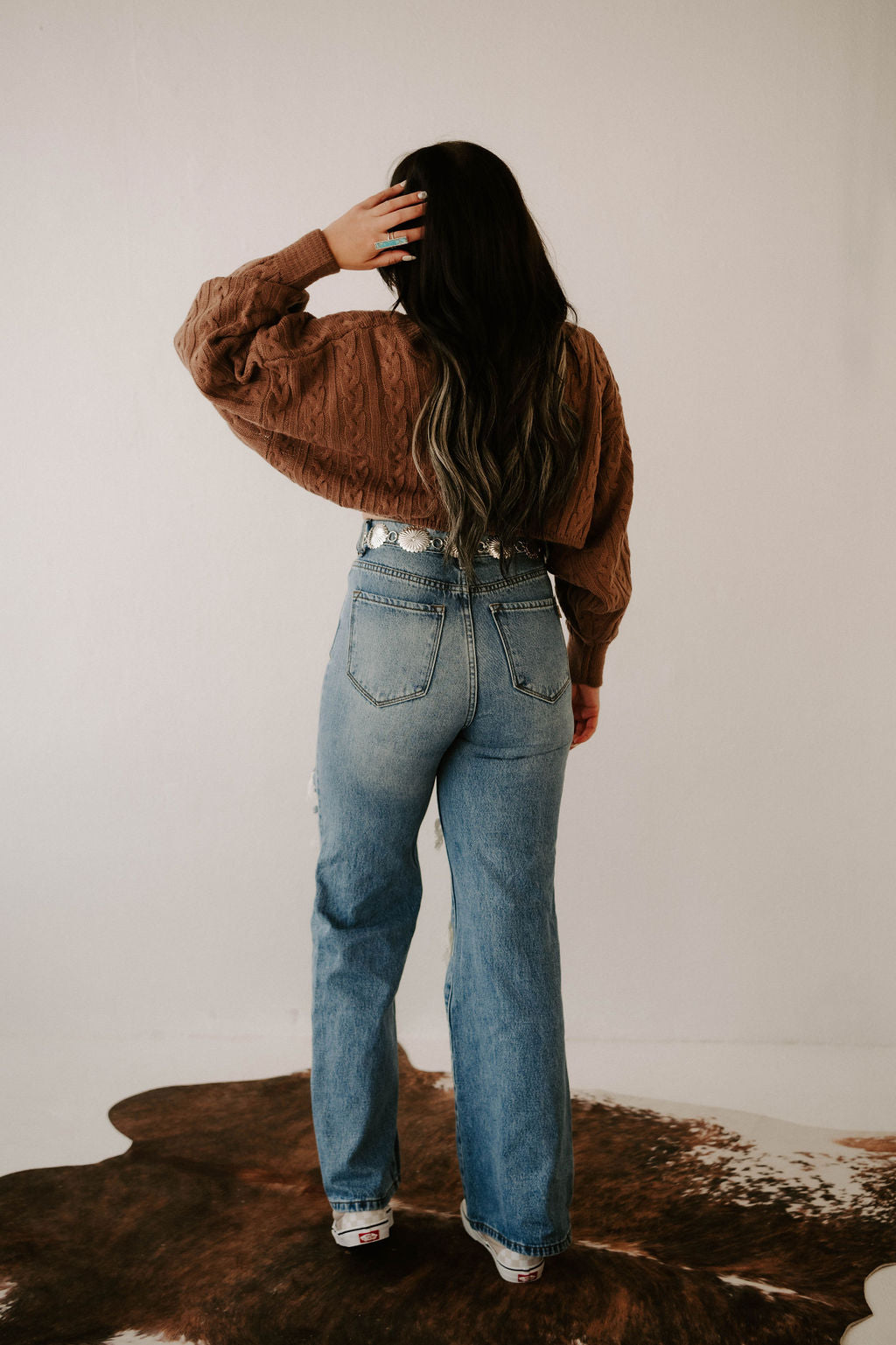 Wild Cactus Boutique Kimber's Fall Boho Crop Sweater jacket in cozy knit with bohemian style, displayed on a hanger.