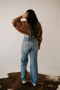 Wild Cactus Boutique Kimber's Fall Boho Crop Sweater jacket in cozy knit with bohemian style, displayed on a hanger.