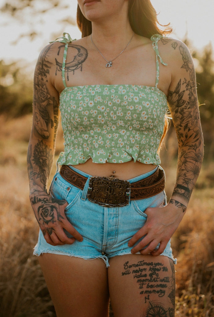 Wildflower Elegance Trail Blouse, a stylish women's shirt from Wild Cactus Boutique, featuring floral patterns and lightweight fabric.