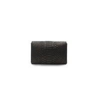 Black Rita Mini clutch by Ximena Kavalekas with sleek design and compact size, perfect for evening events.