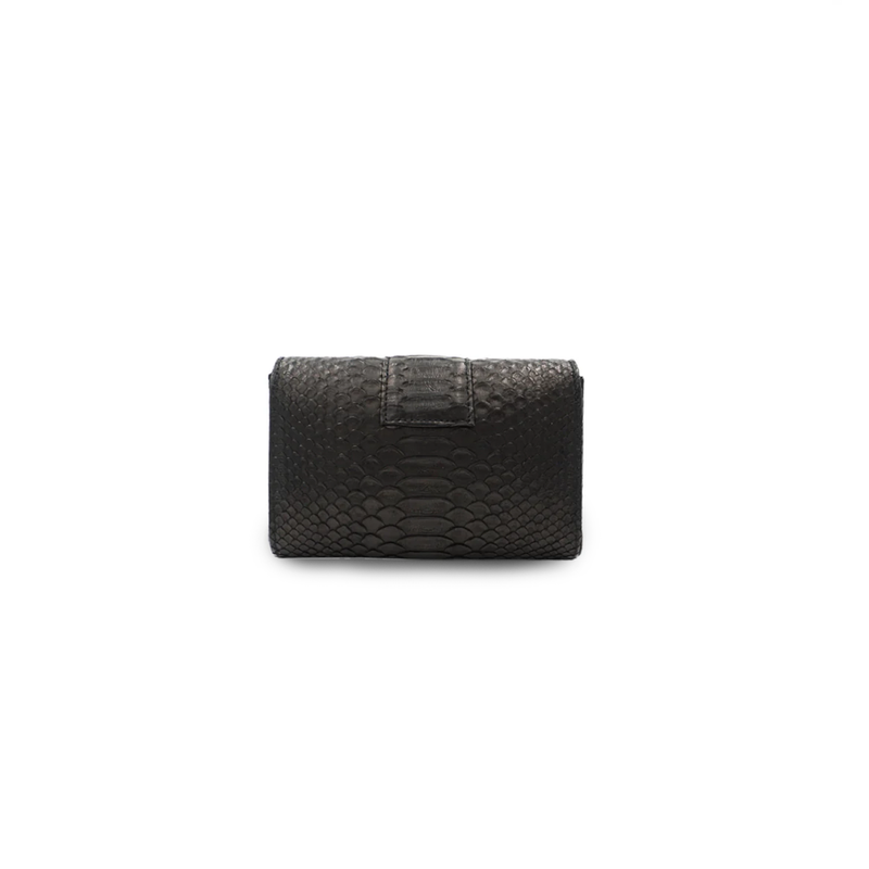 Black Rita Mini clutch by Ximena Kavalekas with sleek design and compact size, perfect for evening events.