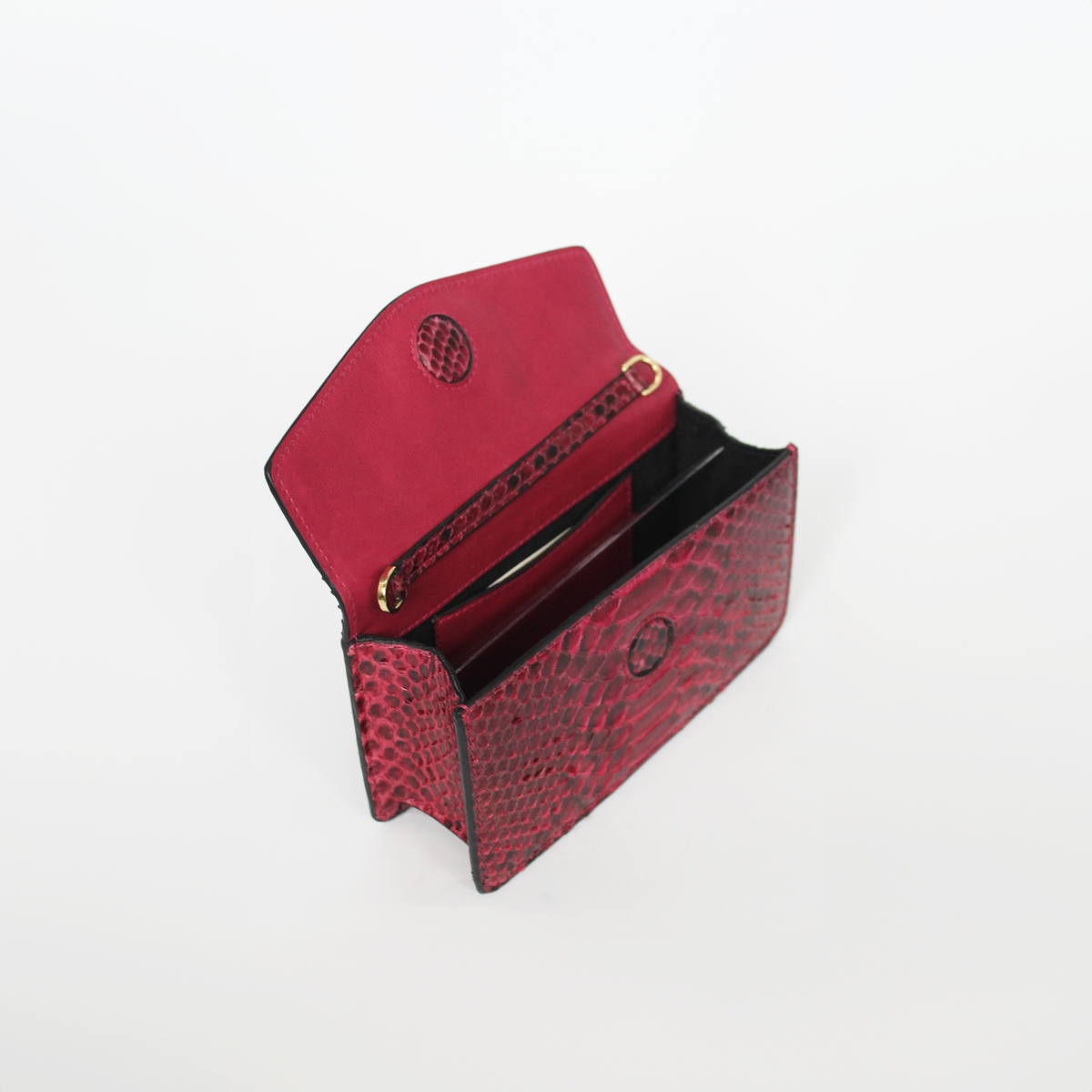 Ximena Kavalekas The Met Clutch in wine color, stylish designer clutch with elegant design and textured finish.