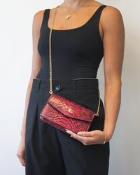 Ximena Kavalekas The Met Clutch in wine color, sleek designer clutch bag with a smooth finish and elegant shape.