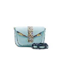 Ximena Kavalekas Kara blue leather crossbody bag with sleek design and adjustable strap, front view showing smooth blue leather finish.