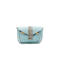 Ximena Kavalekas Kara blue leather crossbody bag with front view, showcasing sleek design and vibrant color.