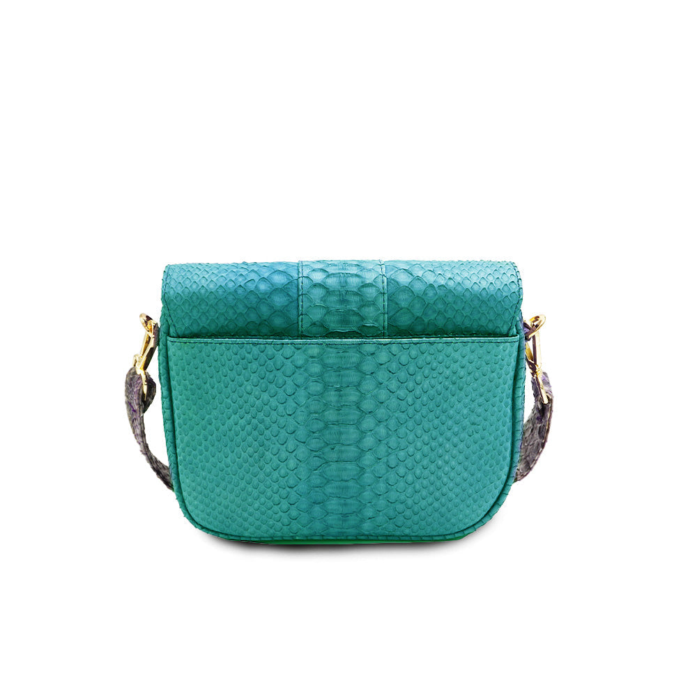 Ximena Kavalekas turquoise crossbody bag named Kara, shown from the back view with sleek design and adjustable strap.