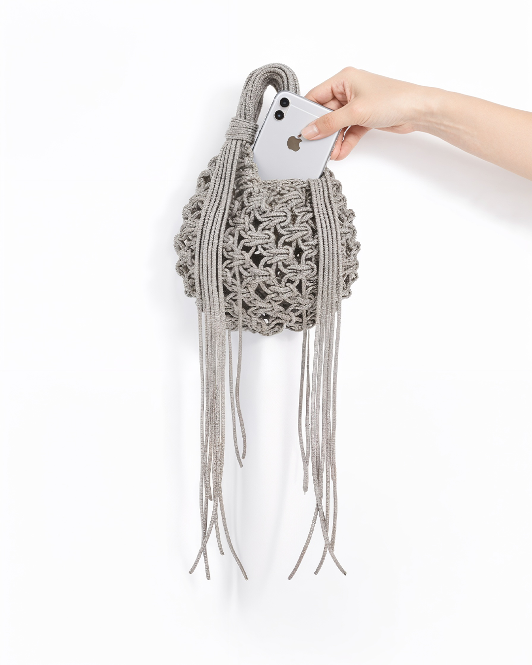 Silver chandelier handbag by Ximena Kavalekas with intricate design and elegant chain strap, stylish accessory for special occasions.