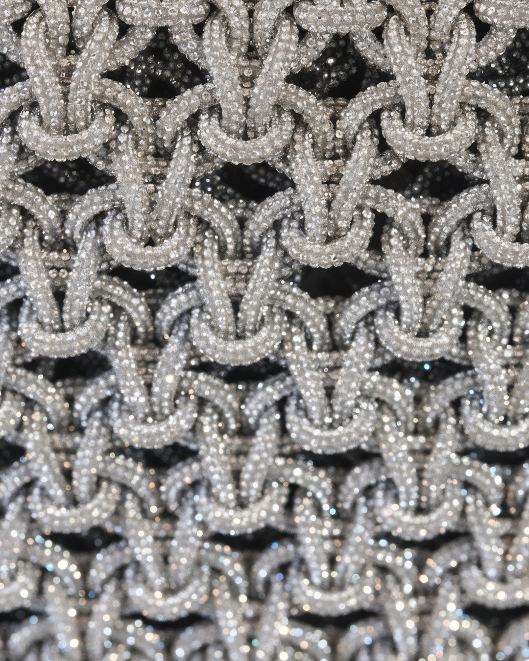 Silver chandelier handbag by Ximena Kavalekas, stylish evening bag with intricate design and metallic finish.