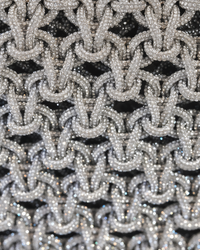 Silver chandelier handbag by Ximena Kavalekas, stylish evening bag with intricate design and metallic finish.