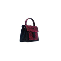 Ximena Kavalekas Emma handbag in wine and black leather, showing a side view with stylish design and elegant details.
