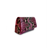 Ximena Kavalekas Enzo handbag in Electra Pink, showcasing side view with sleek design and vibrant color.
