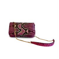 Ximena Kavalekas Enzo handbag in vibrant Electra Pink with sleek design and textured leather finish.